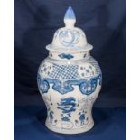 An Oriental style blue and white lidded jar