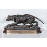 A bronze figure of a gun dog