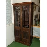 A bookcase with Oriental style panels