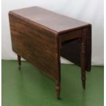 A mahogany drop leaf table