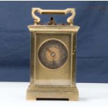 A small brass carriage clock