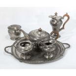 An Art deco hammered pewter tea set, biscuit barrel and tray. stamped FC