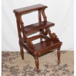 A pair of mahogany library steps