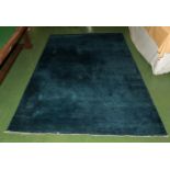 A thick pile blue ground woolen rug