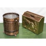 A copper coal bucket and a brass magazine rack