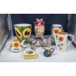 A collection of sunflower decorated pottery