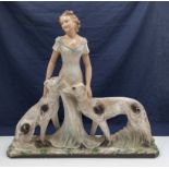 An Art Deco chalk figure lady with hounds