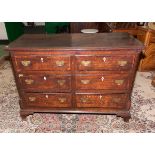 A period oak chest with mahogany cross banding