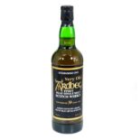 A bottle of Ardbeg finest Islay single malt Scotch whisky guaranteed 30 years old, distilled in 1966