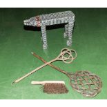 A stool, two carpet beaters and a brush