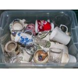 A box of pottery kitchen ware