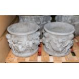 A pair of reconstituted stone garden planters