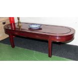 An Oriental style mahogany coffee table