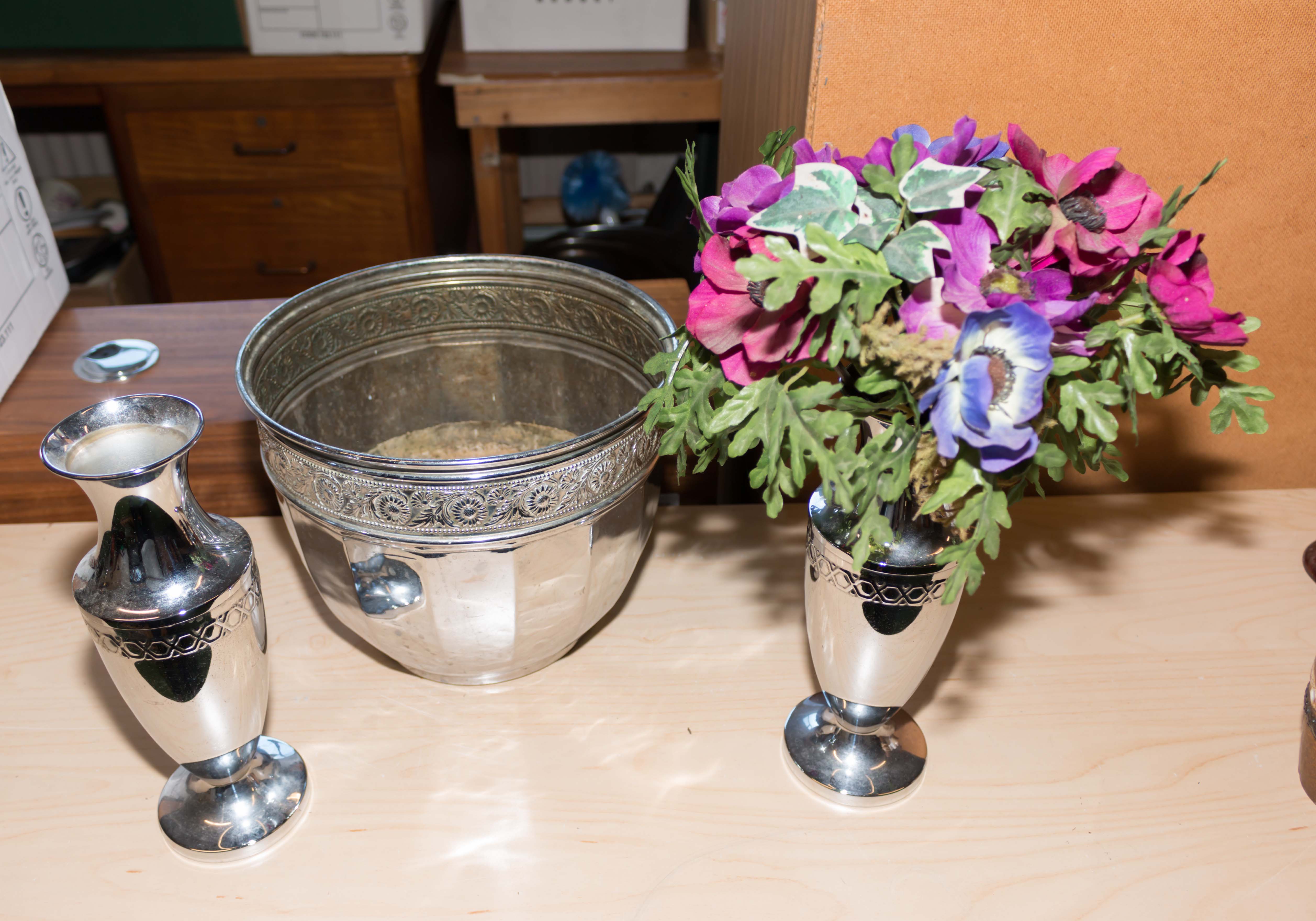 A metal jardiniere and two vases