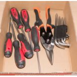 A set of screwdrivers, tin snips and a set of torque keys