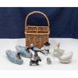 A box of pottery animals and a wine carrier