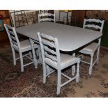 A painted dining table and four chairs