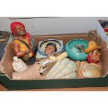 A box containing pottery figures and wall