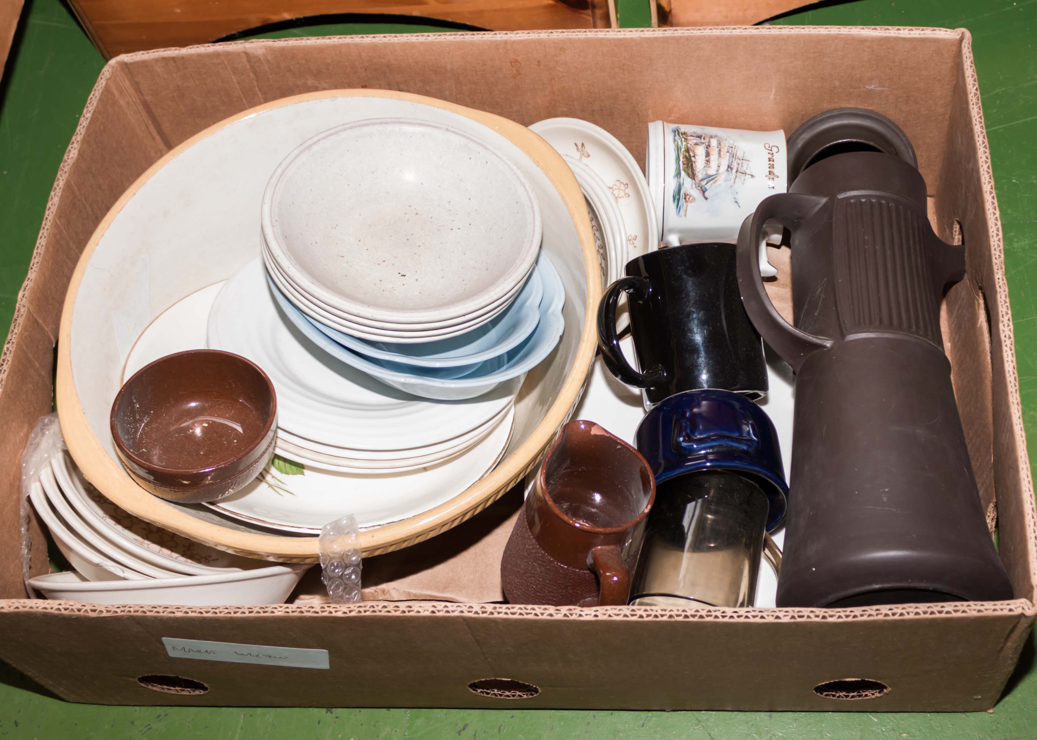 A box containing pottery items