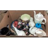 A box containing pottery and metal ware