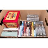 A box containing DVDs and Cds