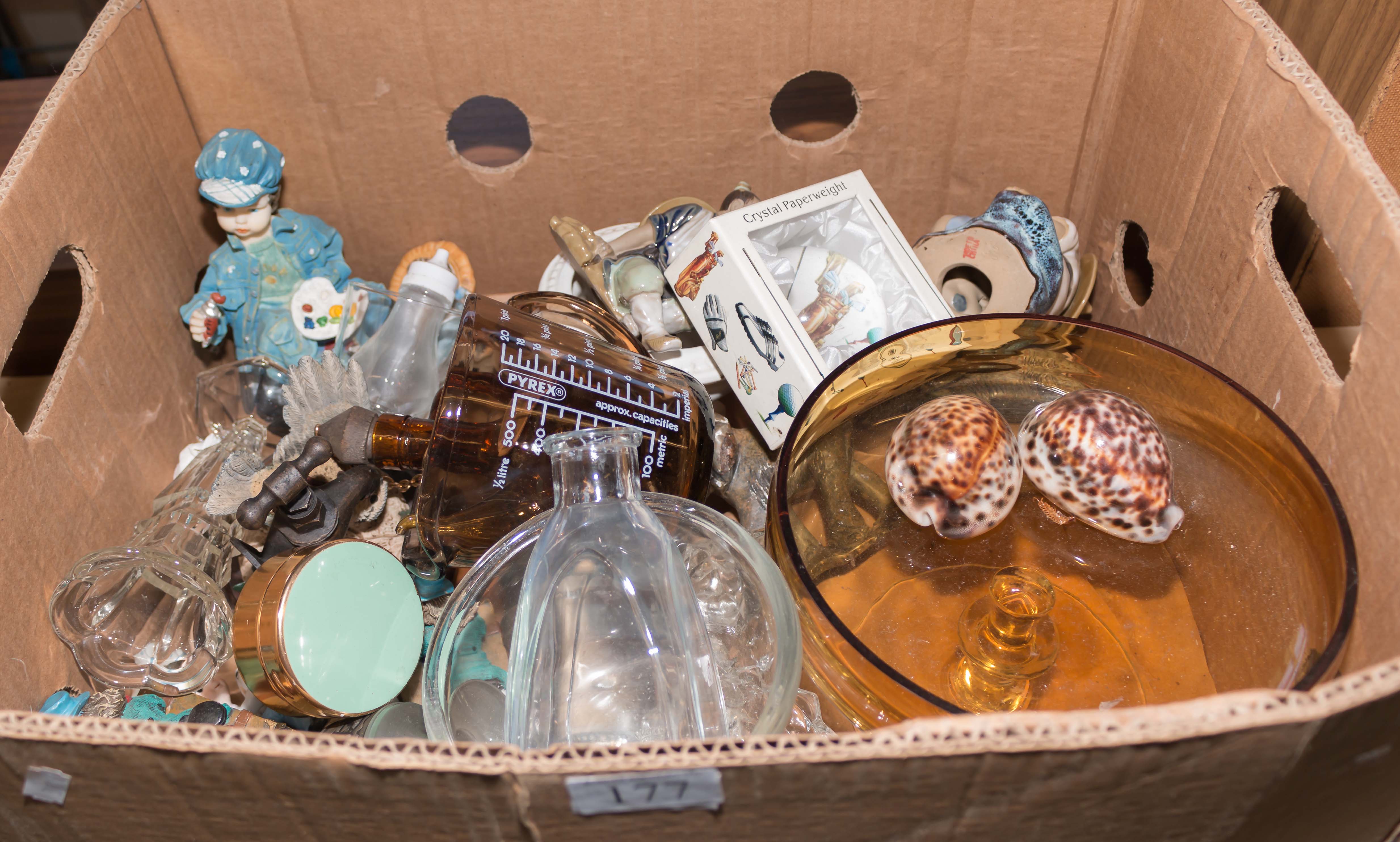 A box containing pottery and glass