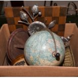 A box of assorted items and a globe