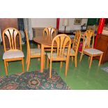 A circular kitchen table and six chairs