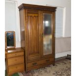 A mahogany two door wardrobe