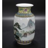 A lantern shaped Chinese Republic period Famille Rose vase decorated with a mountain scene and