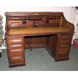 A large oak roll topped desk