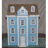 A dolls house complete with furniture
