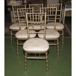Six gold dining chairs