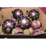 A box containing large Christmas baubles