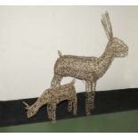 A large animated mesh Christmas deer together with a smaller mesh feeding deer