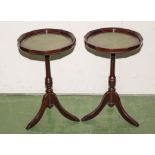 A pair of wine tables with green leather inserts