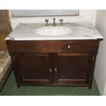 A vanity suite with marble sink insert