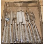 A box containing silver plated cutlery