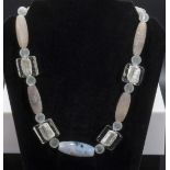 Ancient agate with silver adornments and glass bead necklace