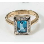 A 9ct gold blue topaz and diamond ring