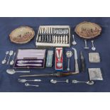 A collection of cutlery, souvenir spoons, cigarette cases and other items