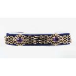 A 9ct gold gate bracelet set with amethyst