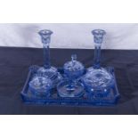 A vintage blue glass dressing table set