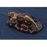 An Art Deco lustre figure of a reclining lady