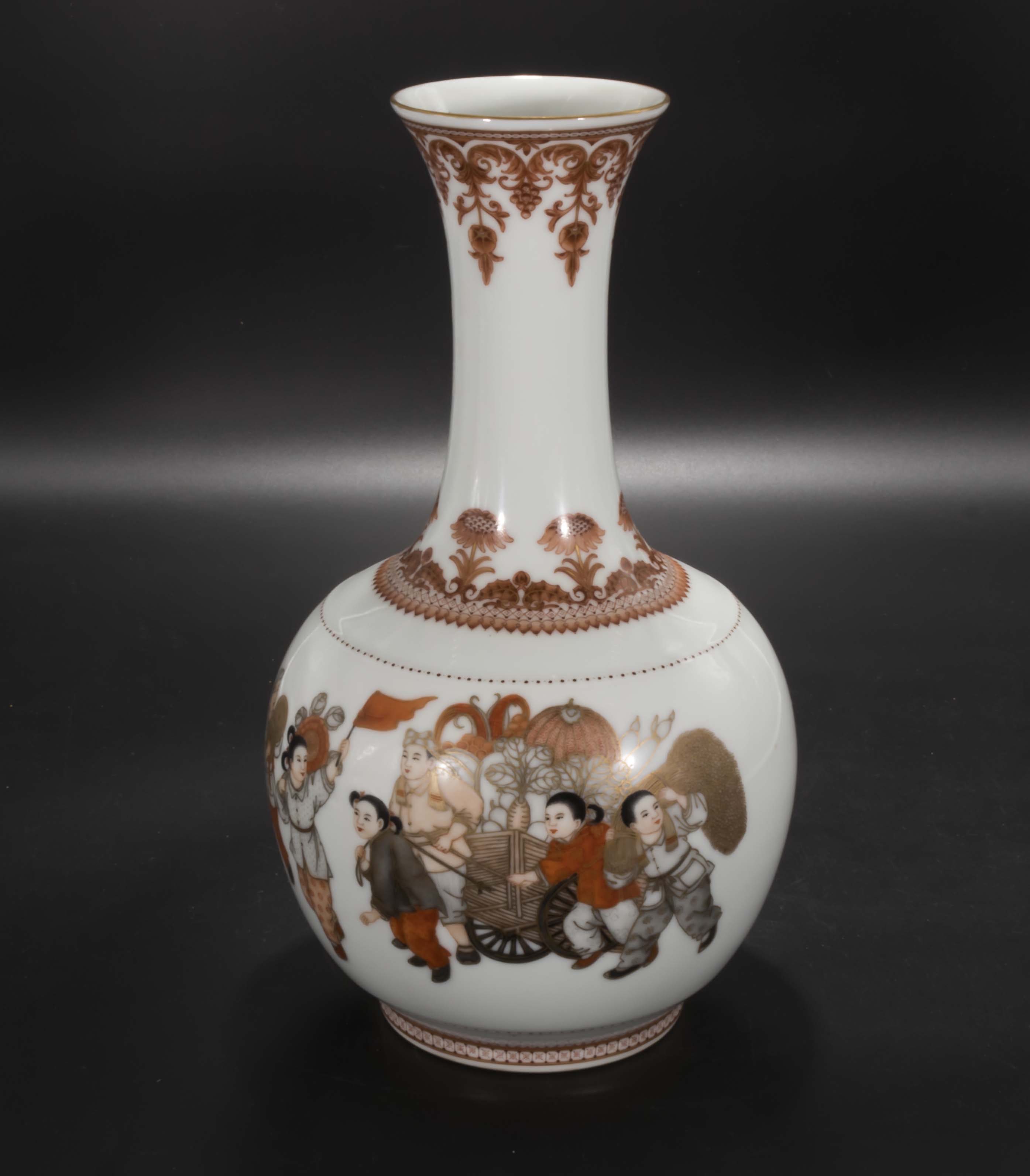 A Chinese Republic period bottle necked vase, decorated with children dancing waving a red flag, 12"