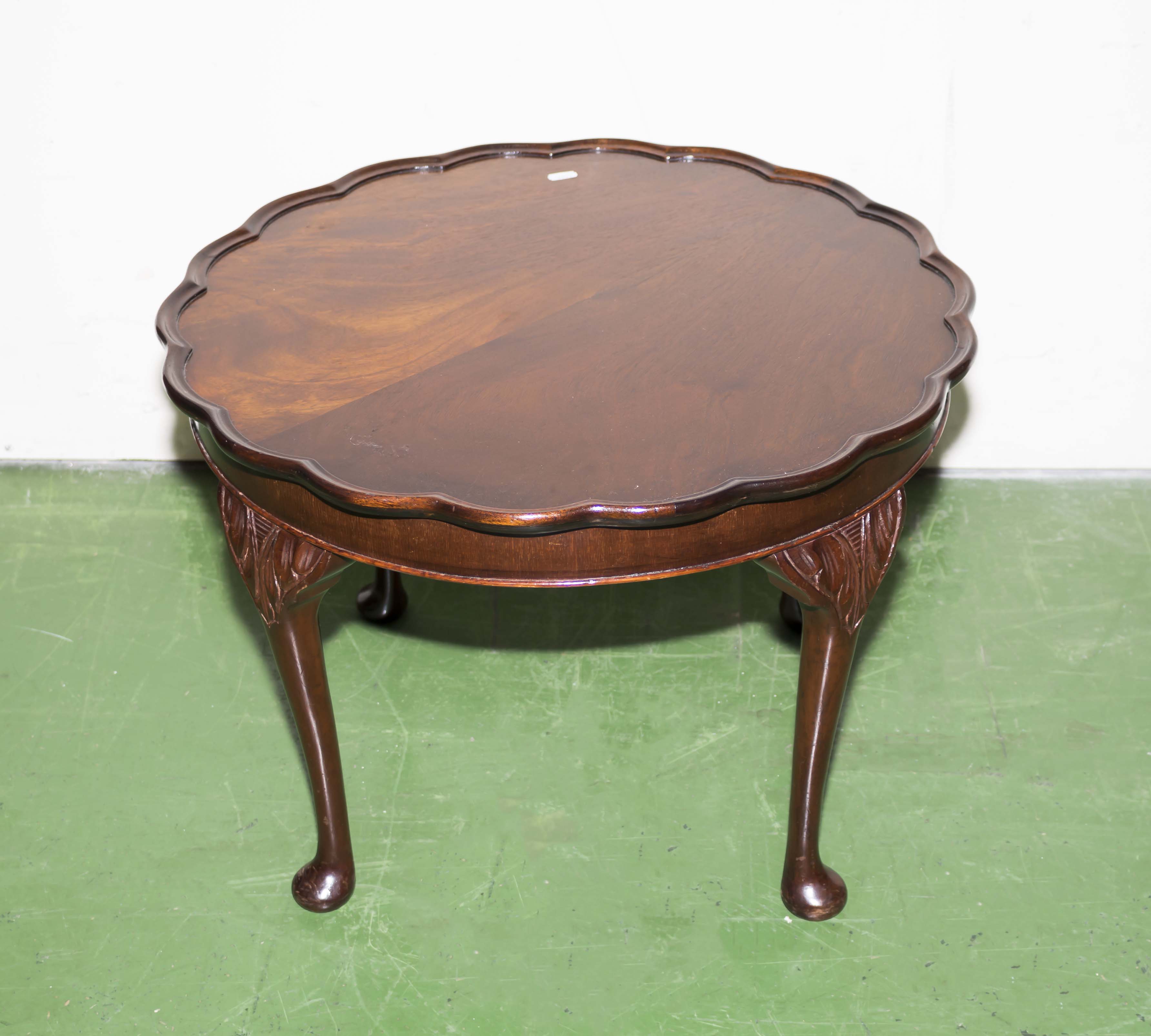 A pie crust edged occasional table