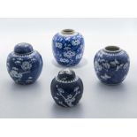 Four 19th/20th century Chinese blue ground prunus ginger jars