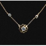 A 9ct gold pendant and chain set with aquamarine
