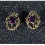 A pair of thistle earrings set with amethysts