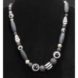 Unique designer black/white necklace with lava rock, agate and glass